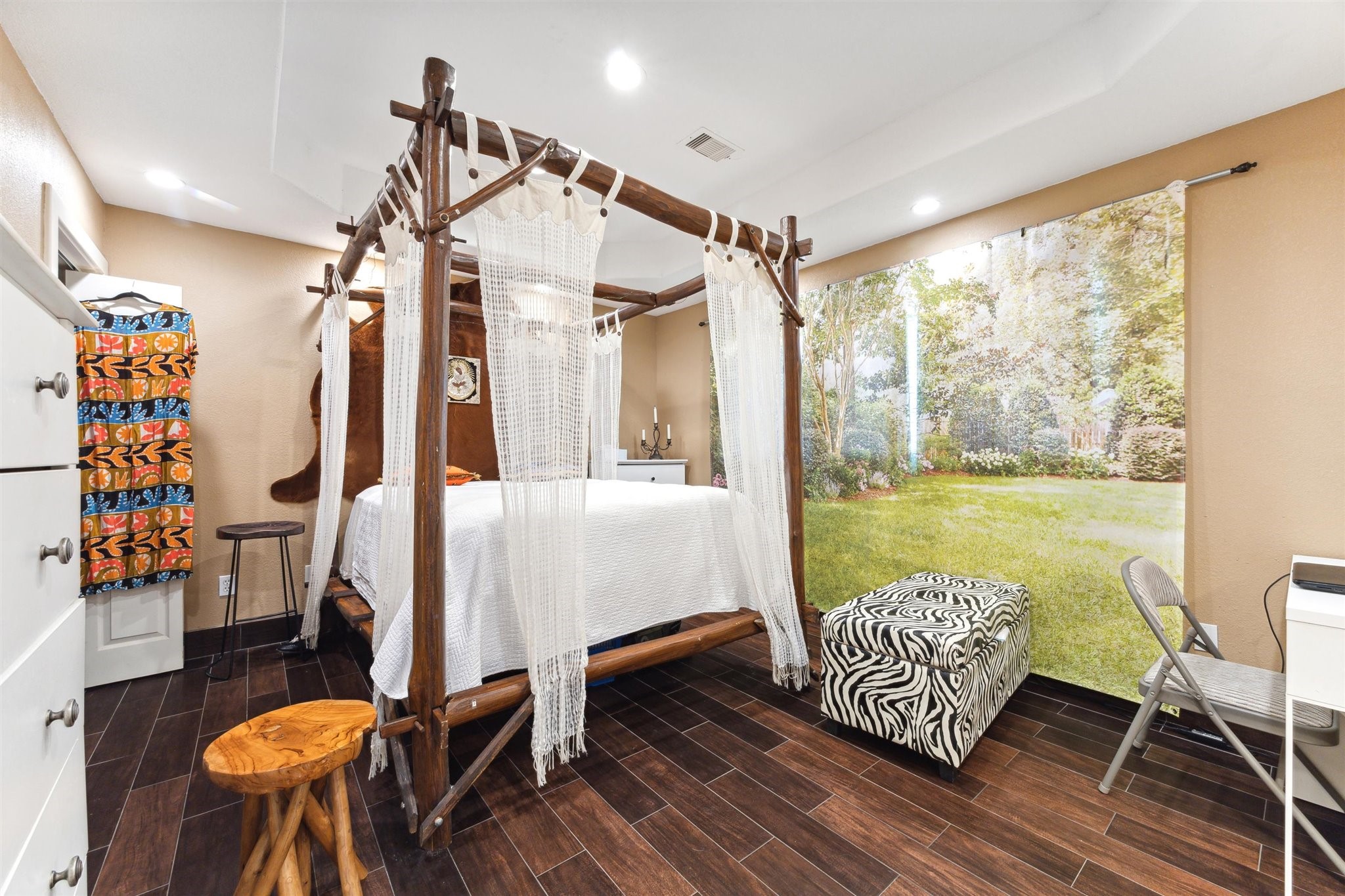 410 Isles End Road Tiki Island, TX 77554 - Photo 6 of 13 a bedroom with furniture and a large window