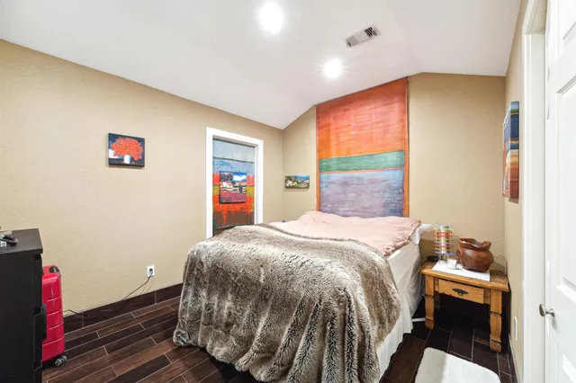 a bed room with a bed and a window