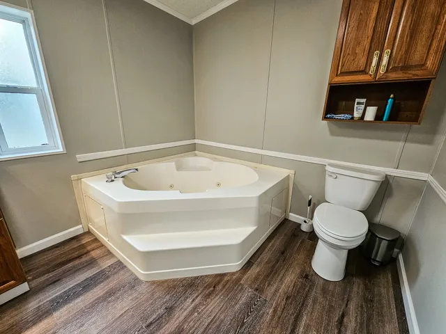 a bathroom with a toilet and a sink