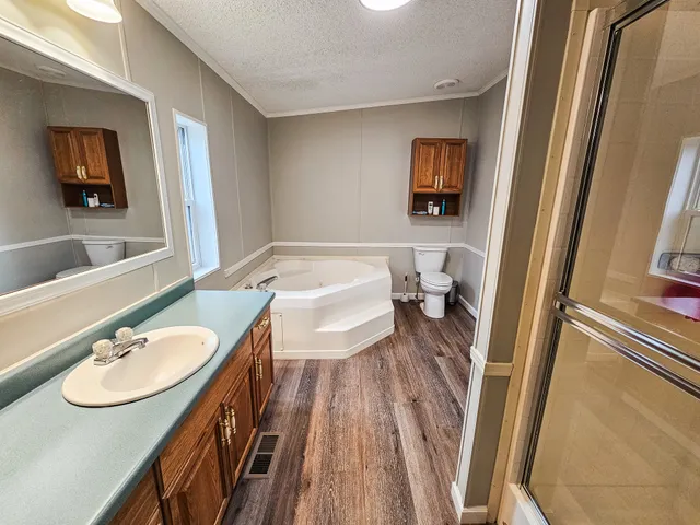 a en suite bathroom with a sink and a mirror