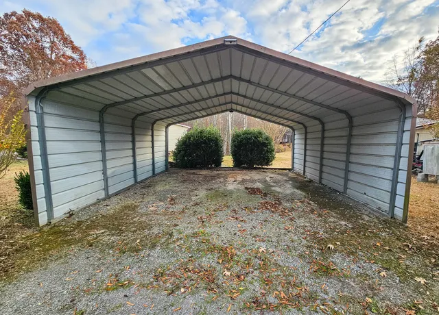 an aerial view of a house with outdoor space