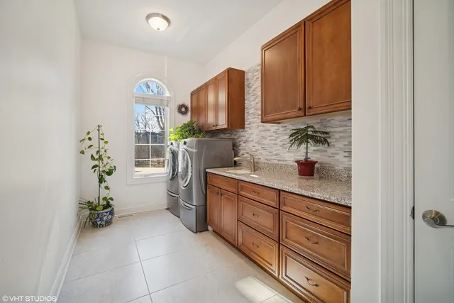 a kitchen with a refrigerator and sink