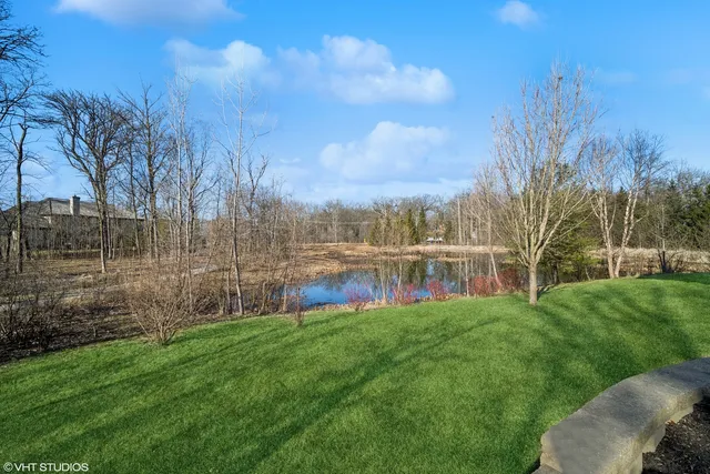 a view of a garden with a building in the background