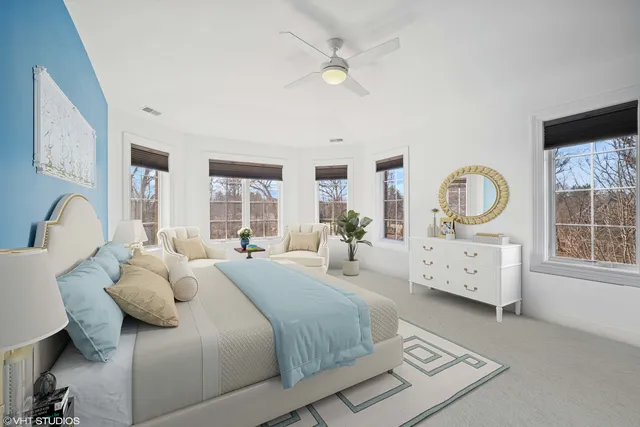 a bedroom with a bed a window and dresser