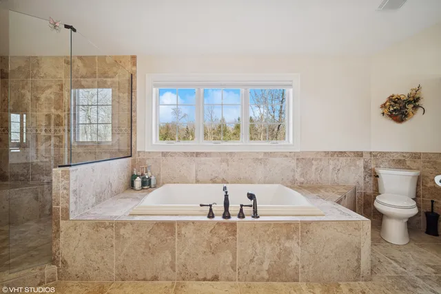 a bathroom with a bathtub and a sink
