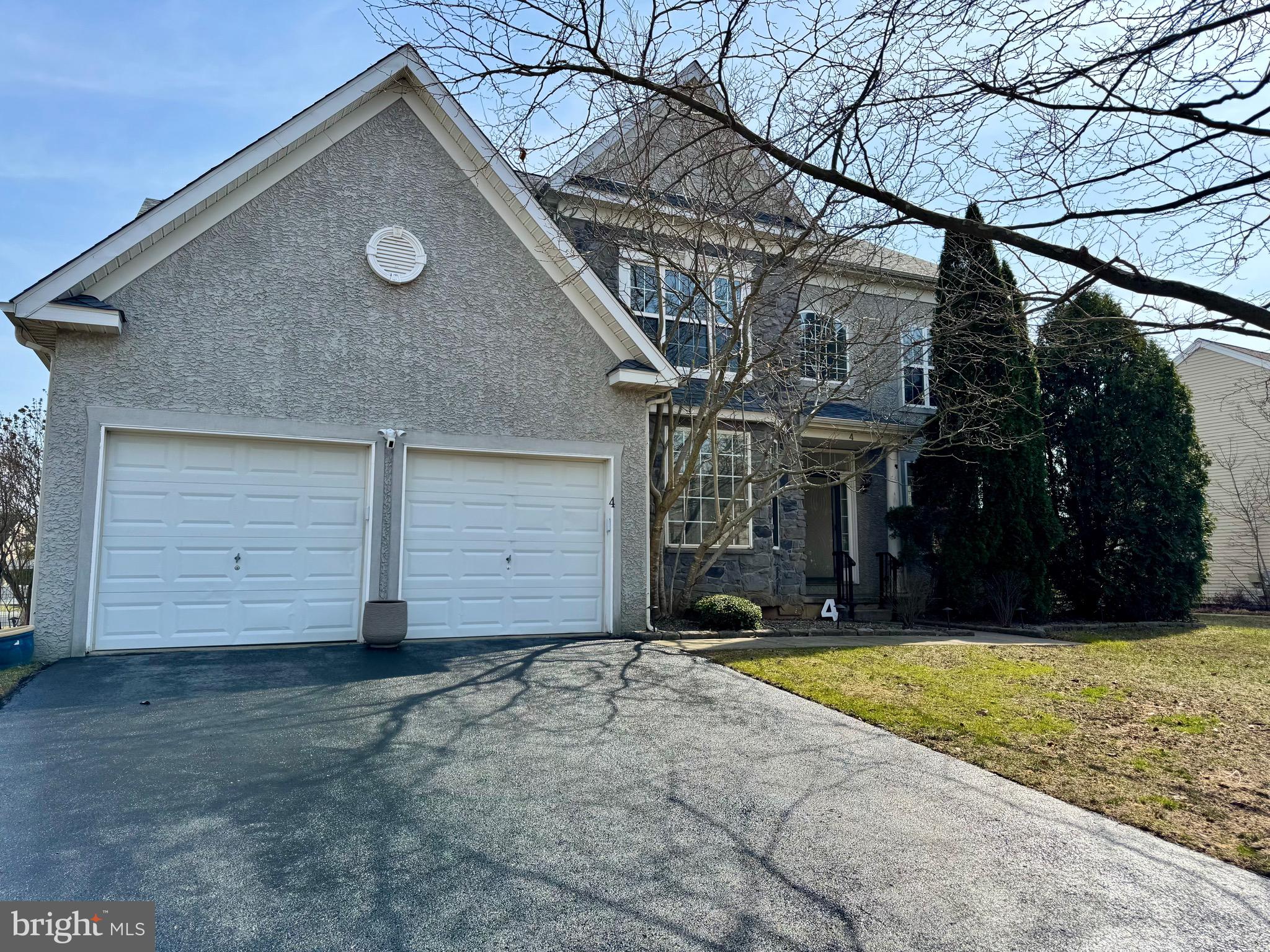a view of a house with a yard and garage