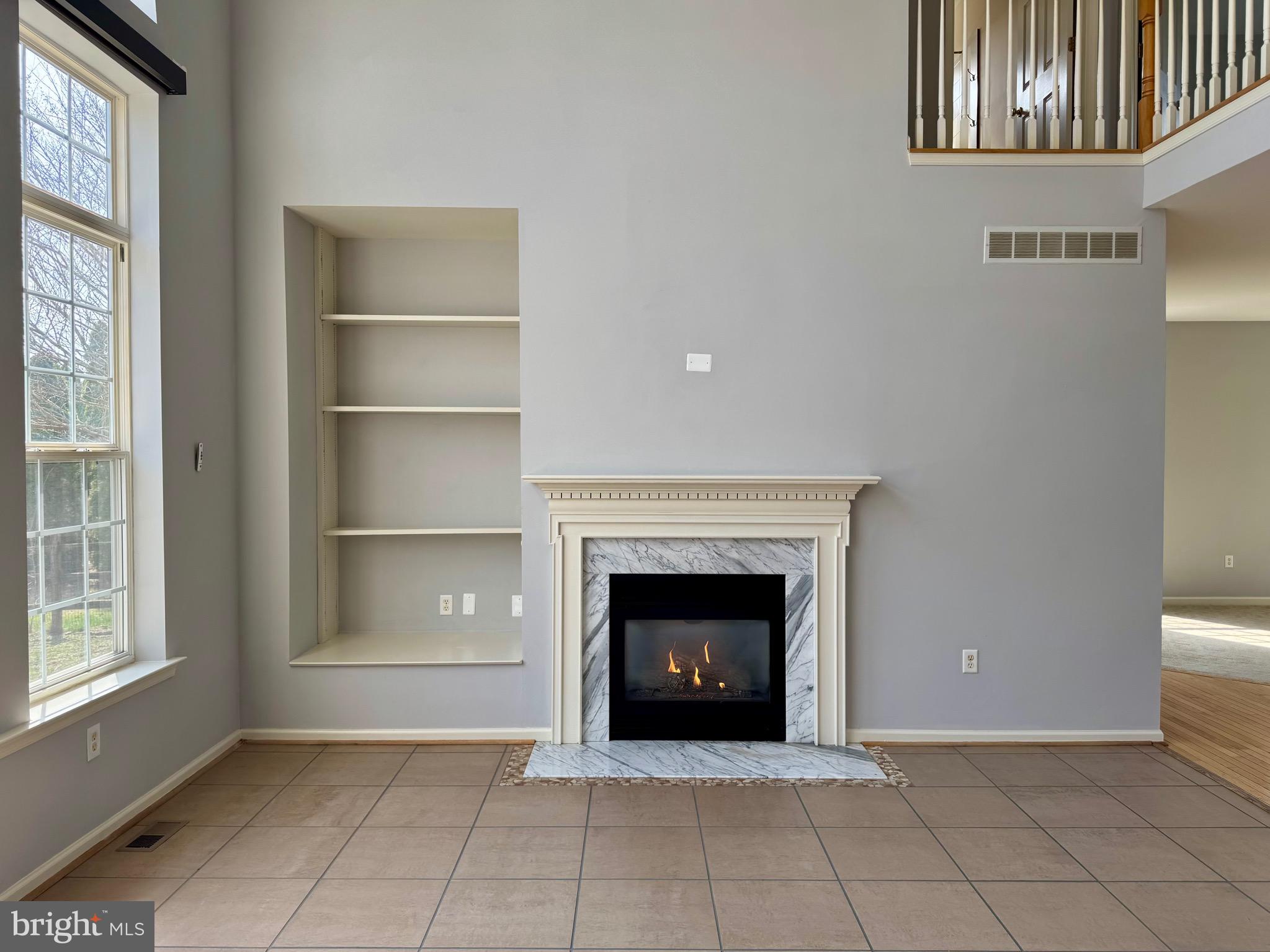 4 Hogan Circle Middletown, DE 19709 - Photo 13 of 60 a view of an empty room with a fireplace and a window