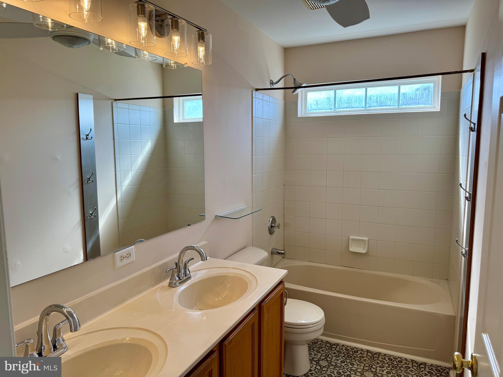 4 Hogan Circle Middletown, DE 19709 - Photo 29 of 60 a bathroom with a sink and a mirror