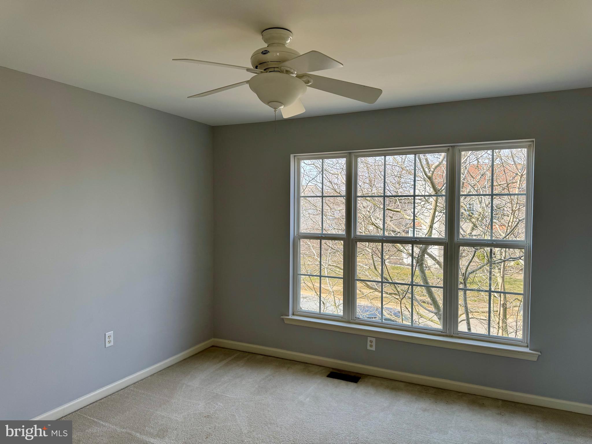 4 Hogan Circle Middletown, DE 19709 - Photo 32 of 60 an empty room with chandelier fan and windows