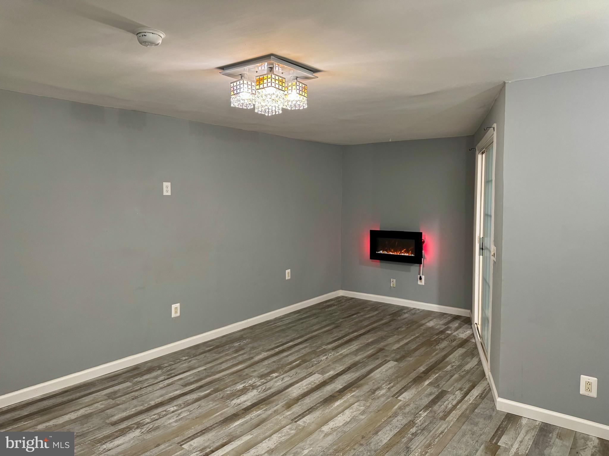4 Hogan Circle Middletown, DE 19709 - Photo 46 of 60 a view of an empty room with a chandelier fan
