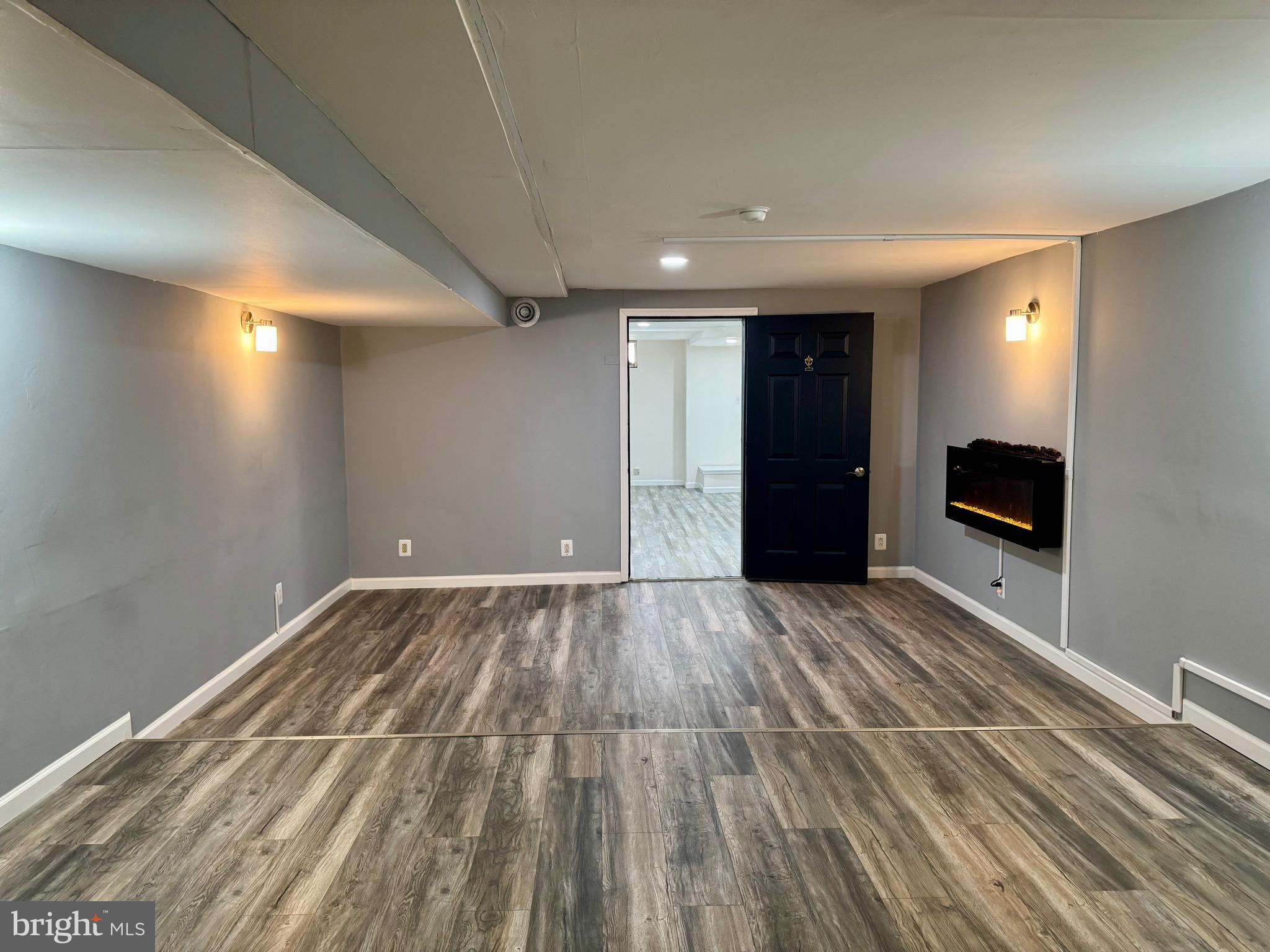 4 Hogan Circle Middletown, DE 19709 - Photo 60 of 60 a view of a livingroom with a flat screen tv wooden floor and a ceiling fan