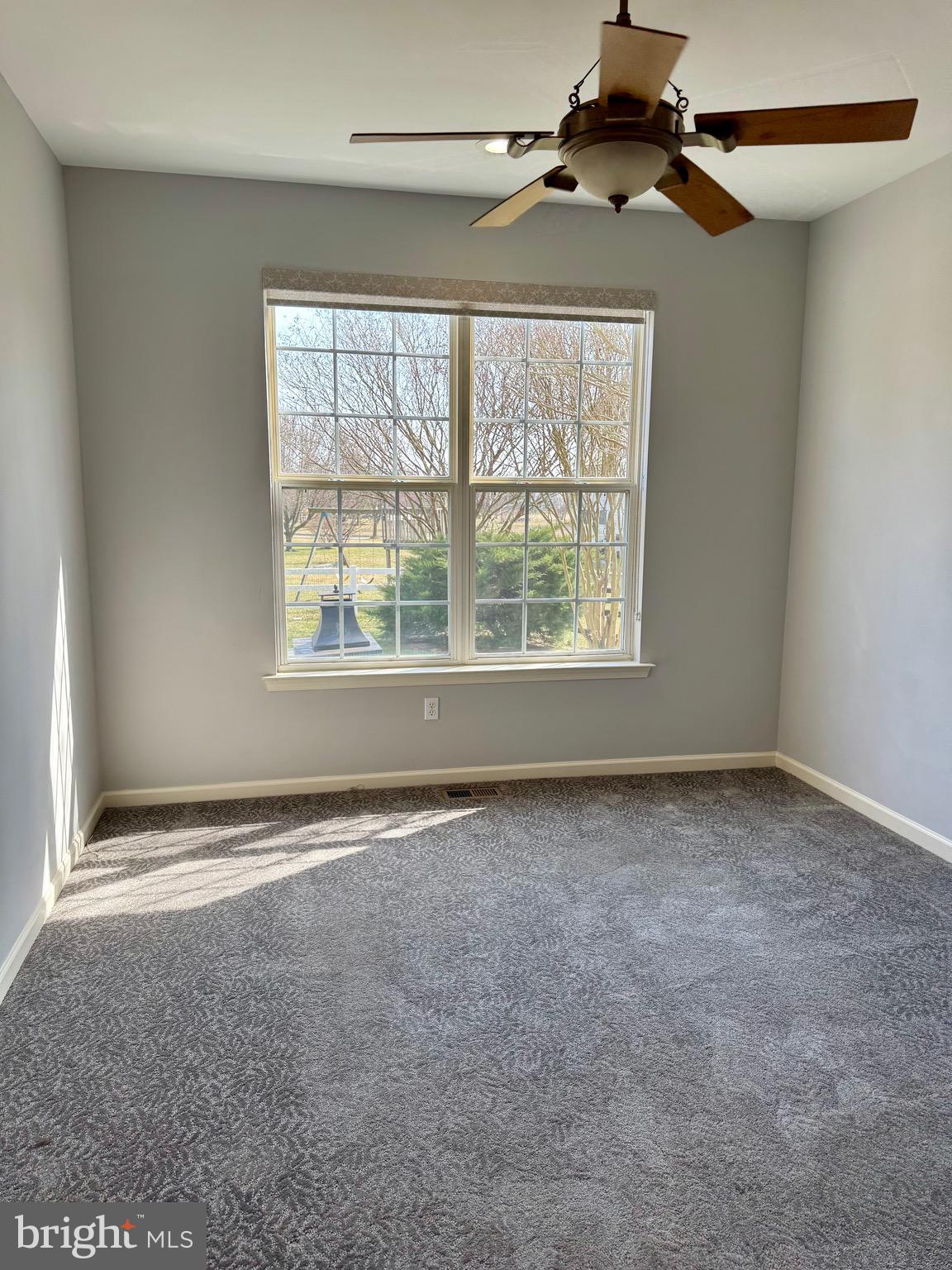 4 Hogan Circle Middletown, DE 19709 - Photo 10 of 60 an empty room with a empty space and windows