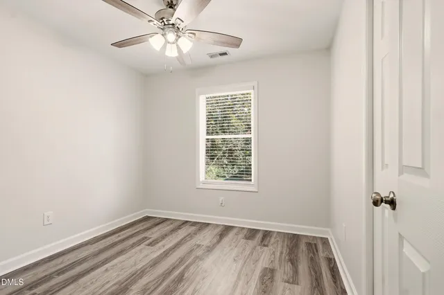 a bathroom with a sink vanity and a mirror