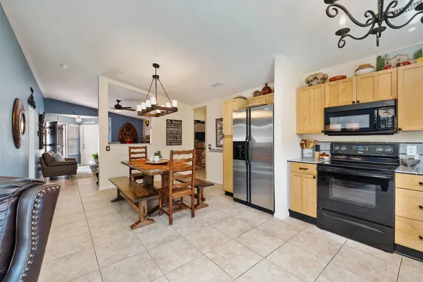 a living room with furniture a rug and a flat screen tv