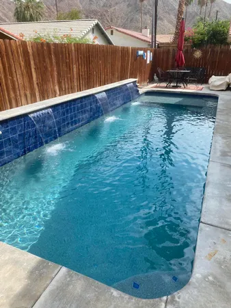 a view of swimming pool with a yard