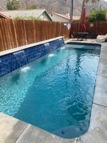 a view of swimming pool with a yard