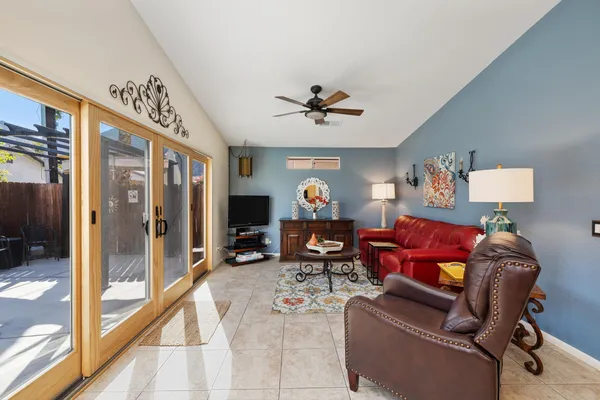 a bedroom with two beds and a window