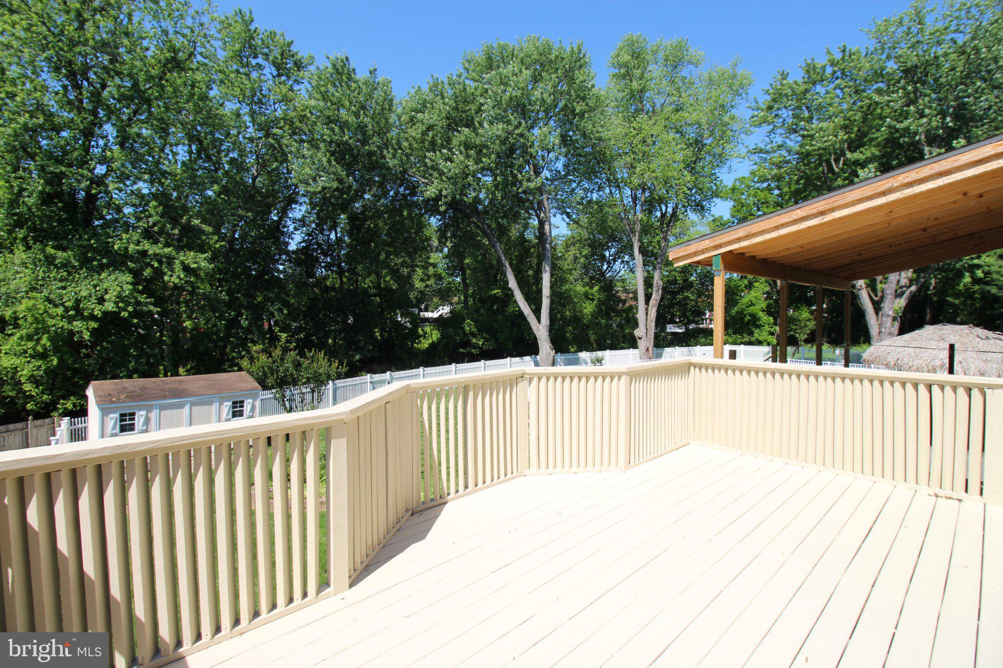 12506 Calpine Road Philadelphia, PA 19154 - Photo 4 of 29 Sunny deck surrounded by lush greenery.