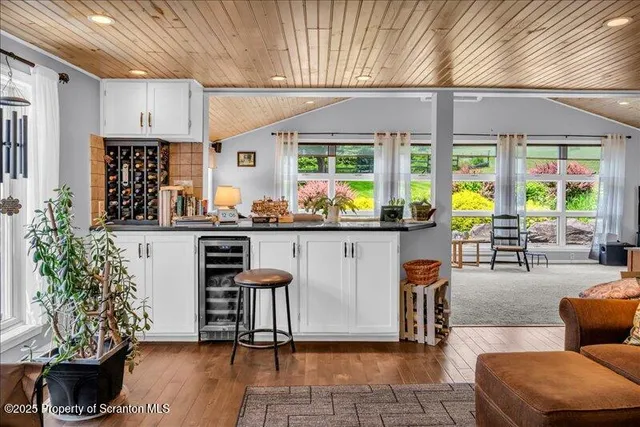 a lobby with furniture and floor to ceiling window