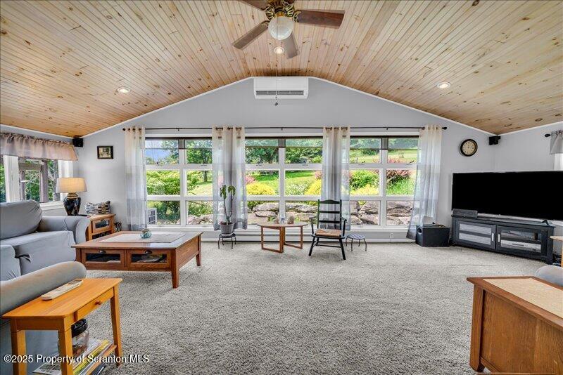 1715 Booth Road Hallstead, PA 18822 - Photo 16 of 39 a living room with furniture and a flat screen tv