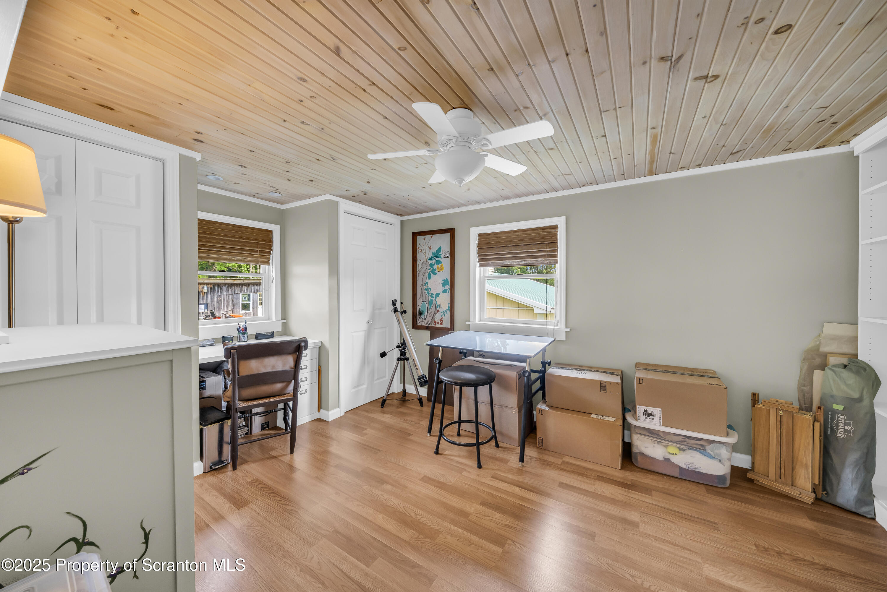 1715 Booth Road Hallstead, PA 18822 - Photo 21 of 39 a view of a workspace with furniture window and wooden floor