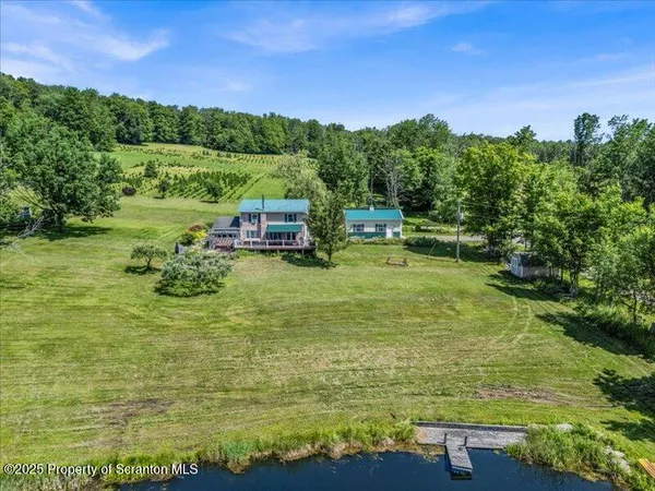 a view of a lake with houses in the background