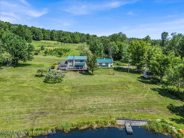 a view of a lake with houses in the background