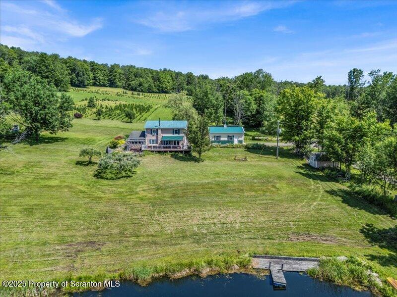 1715 Booth Road Hallstead, PA 18822 - Photo 27 of 39 a view of a lake with houses in the background