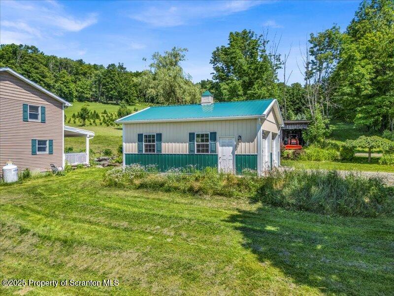 1715 Booth Road Hallstead, PA 18822 - Photo 29 of 39 a front view of a house with a yard