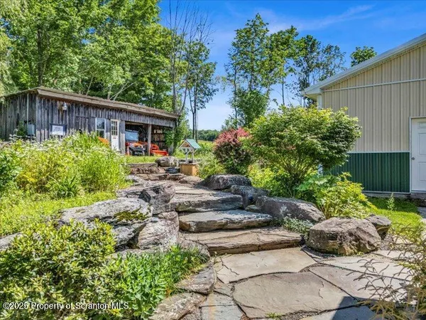 a backyard of a house with lots of green space