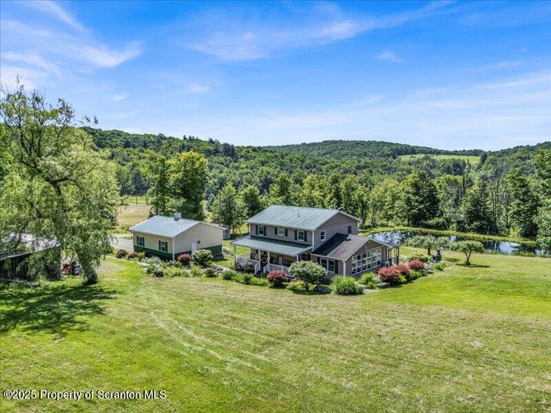 1715 Booth Road Hallstead, PA 18822 - Photo 35 of 39 a garden view with a seating space