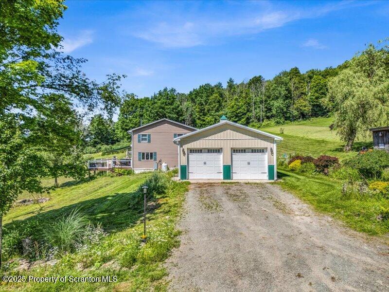 1715 Booth Road Hallstead, PA 18822 - Photo 36 of 39 a view of house with a yard