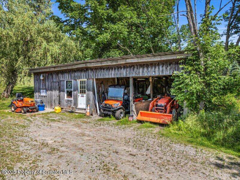 1715 Booth Road Hallstead, PA 18822 - Photo 39 of 39 a view of a house with backyard and sitting area