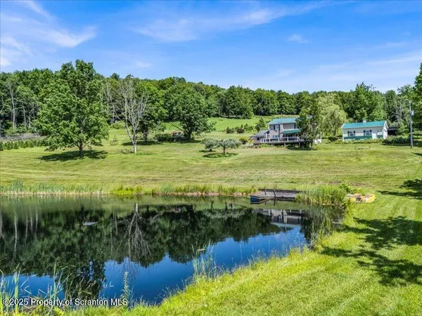 a view of a water with a yard