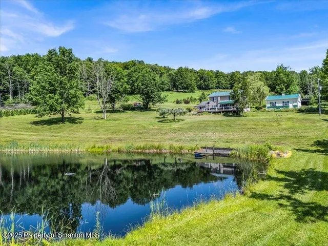 a view of a water with a yard