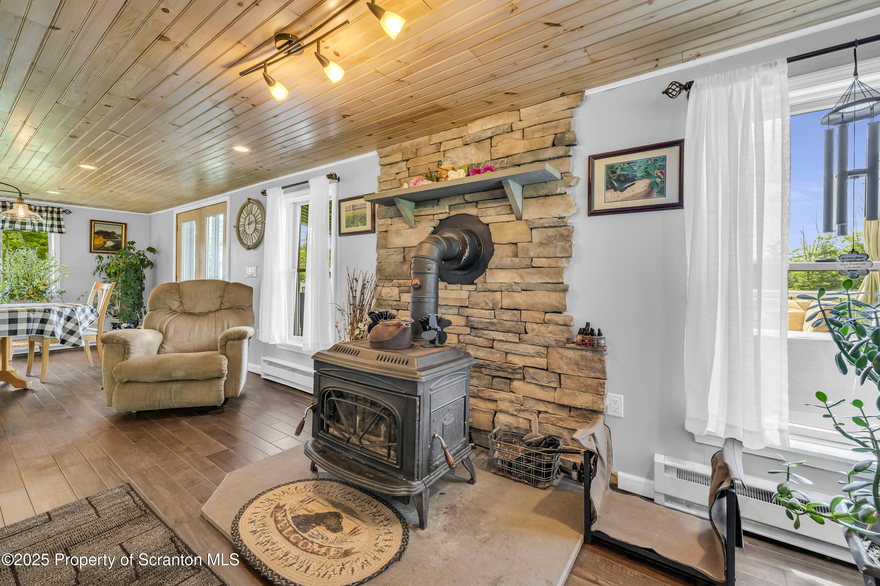 1715 Booth Road Hallstead, PA 18822 - Photo 7 of 39 a living room with furniture and a fireplace