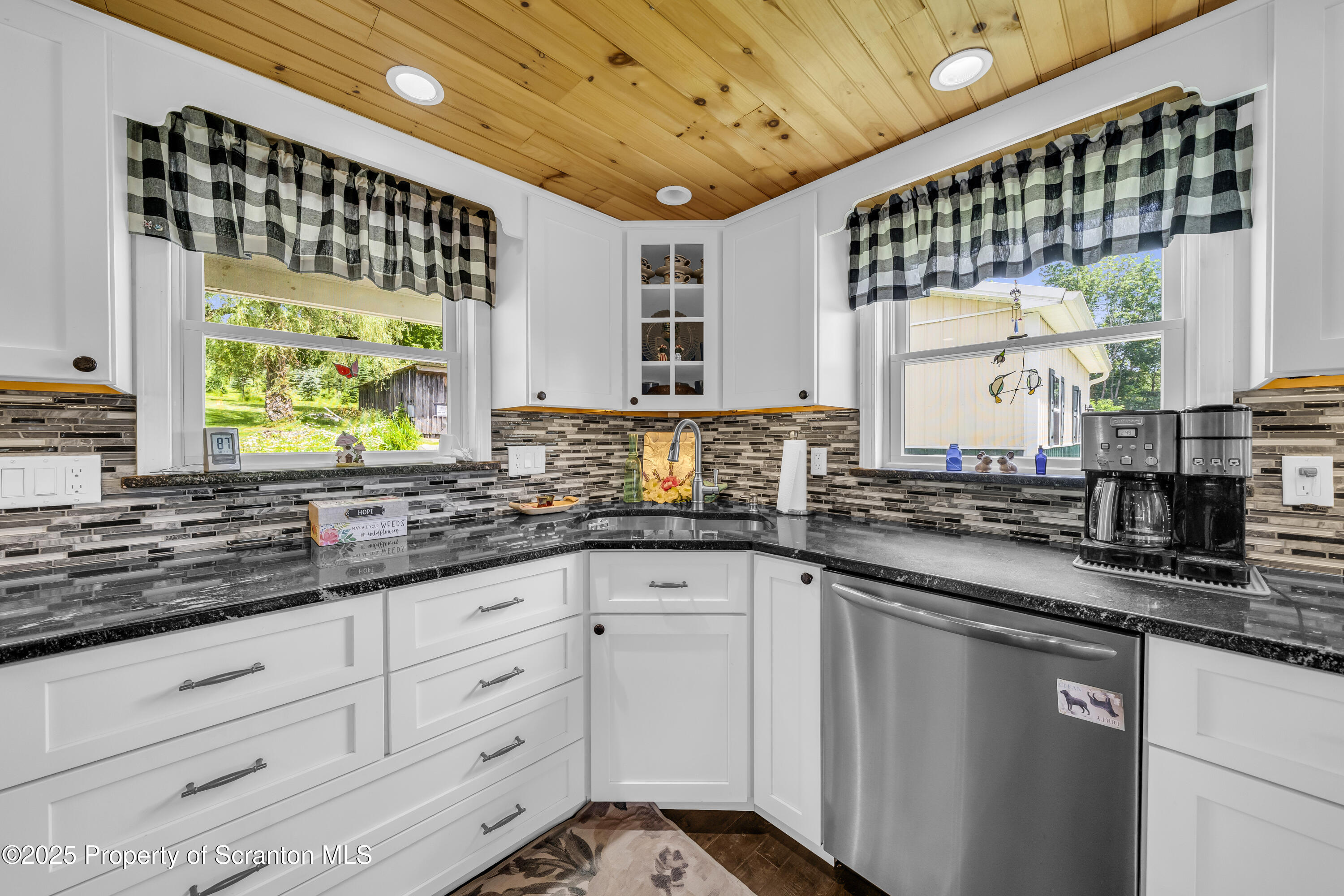 1715 Booth Road Hallstead, PA 18822 - Photo 8 of 39 a kitchen with granite countertop a sink window and cabinets