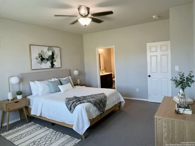 a bedroom with a bed and a couch