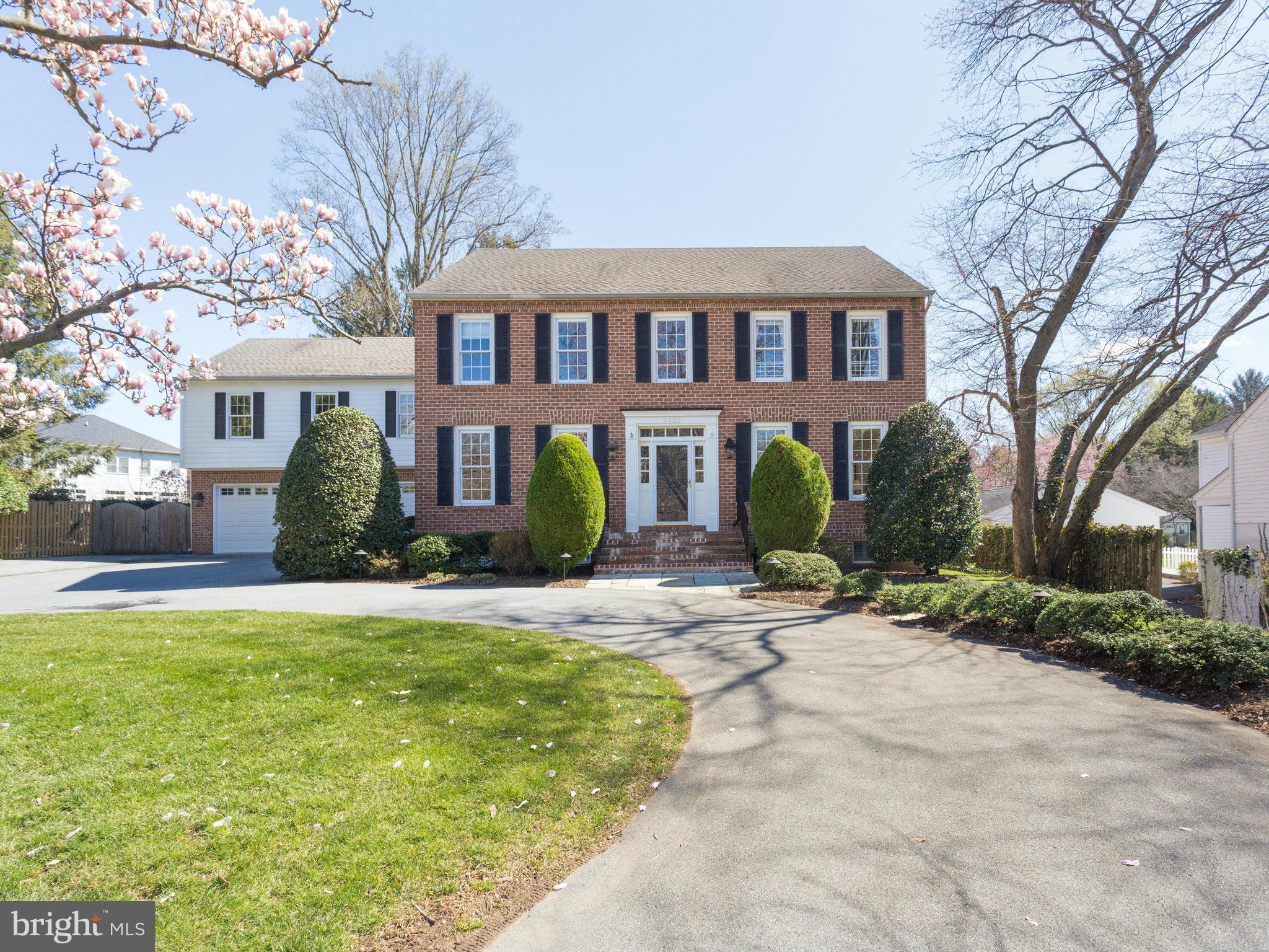 9423 Seven Locks Road Bethesda, MD 20817 - Photo 1 of 28 a front view of a house with yard and green space