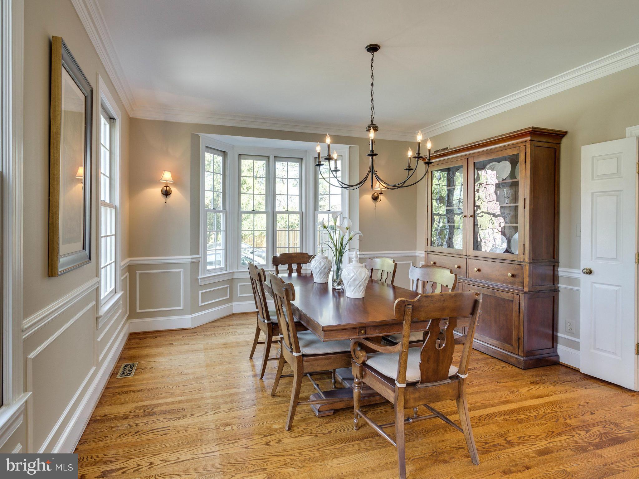 9423 Seven Locks Road Bethesda, MD 20817 - Photo 12 of 28 a view of a dining room with furniture window and wooden floor