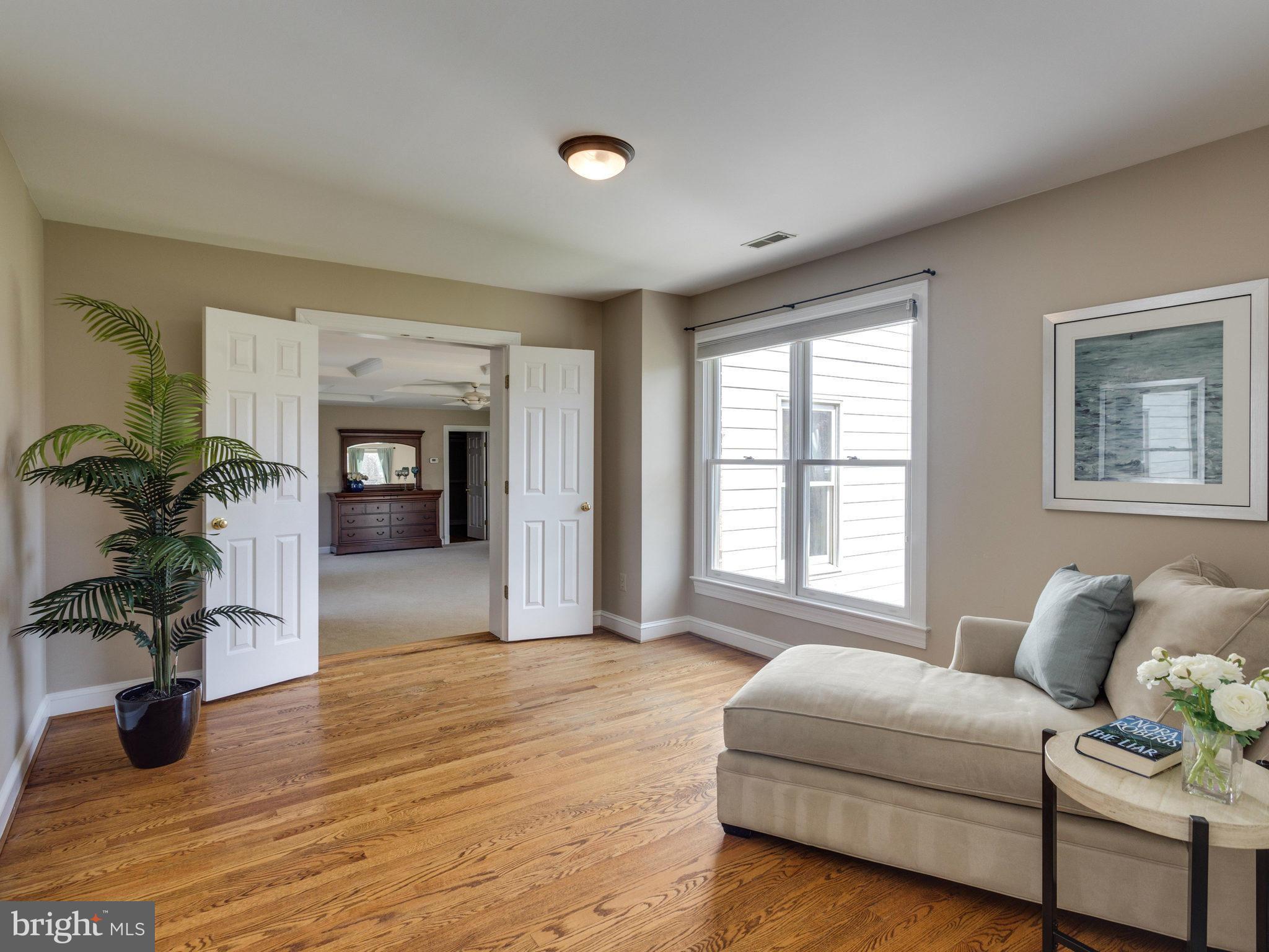 9423 Seven Locks Road Bethesda, MD 20817 - Photo 14 of 28 a living room with furniture and a fireplace