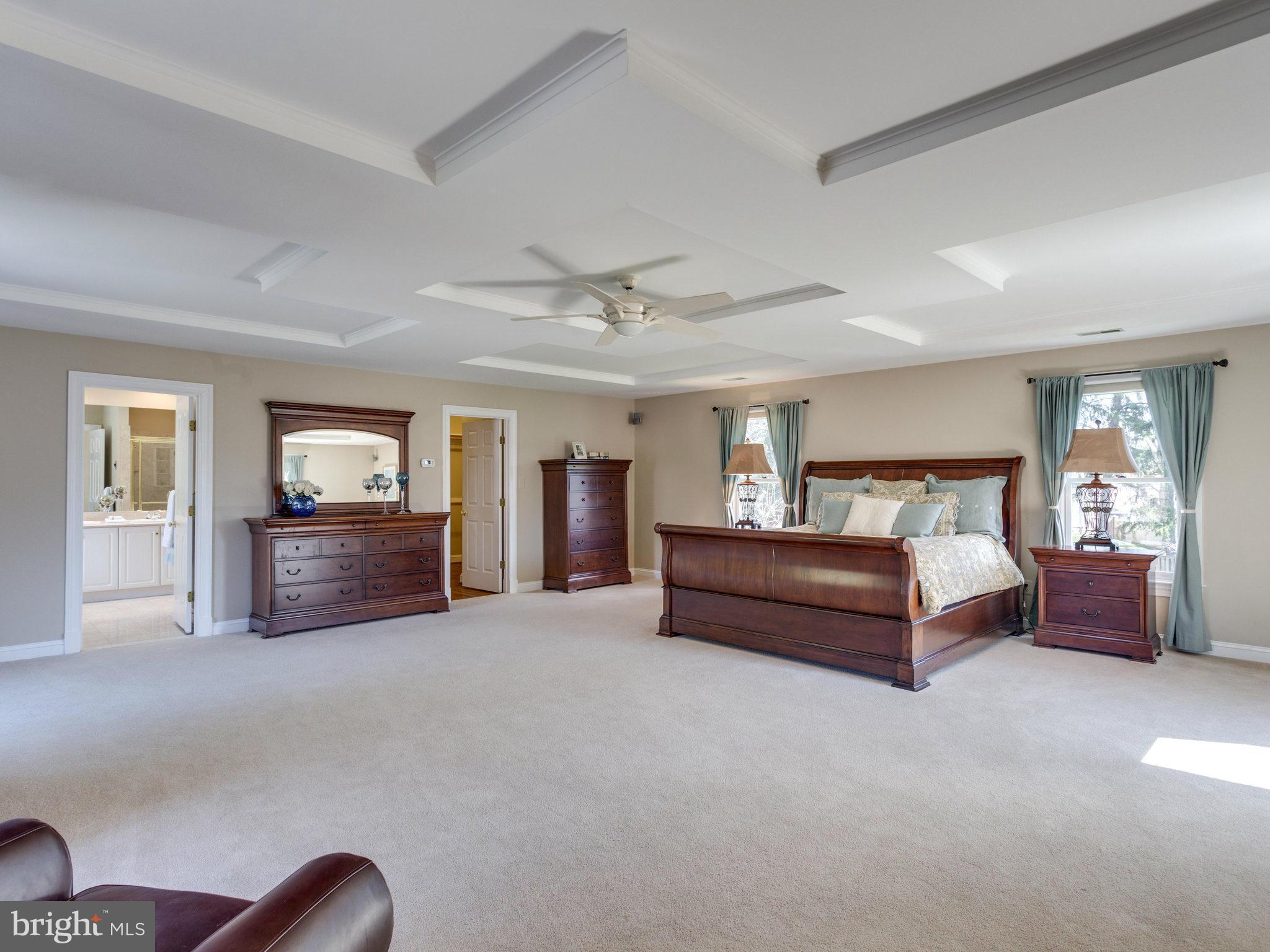 9423 Seven Locks Road Bethesda, MD 20817 - Photo 16 of 28 a spacious bedroom with a bed window and couch