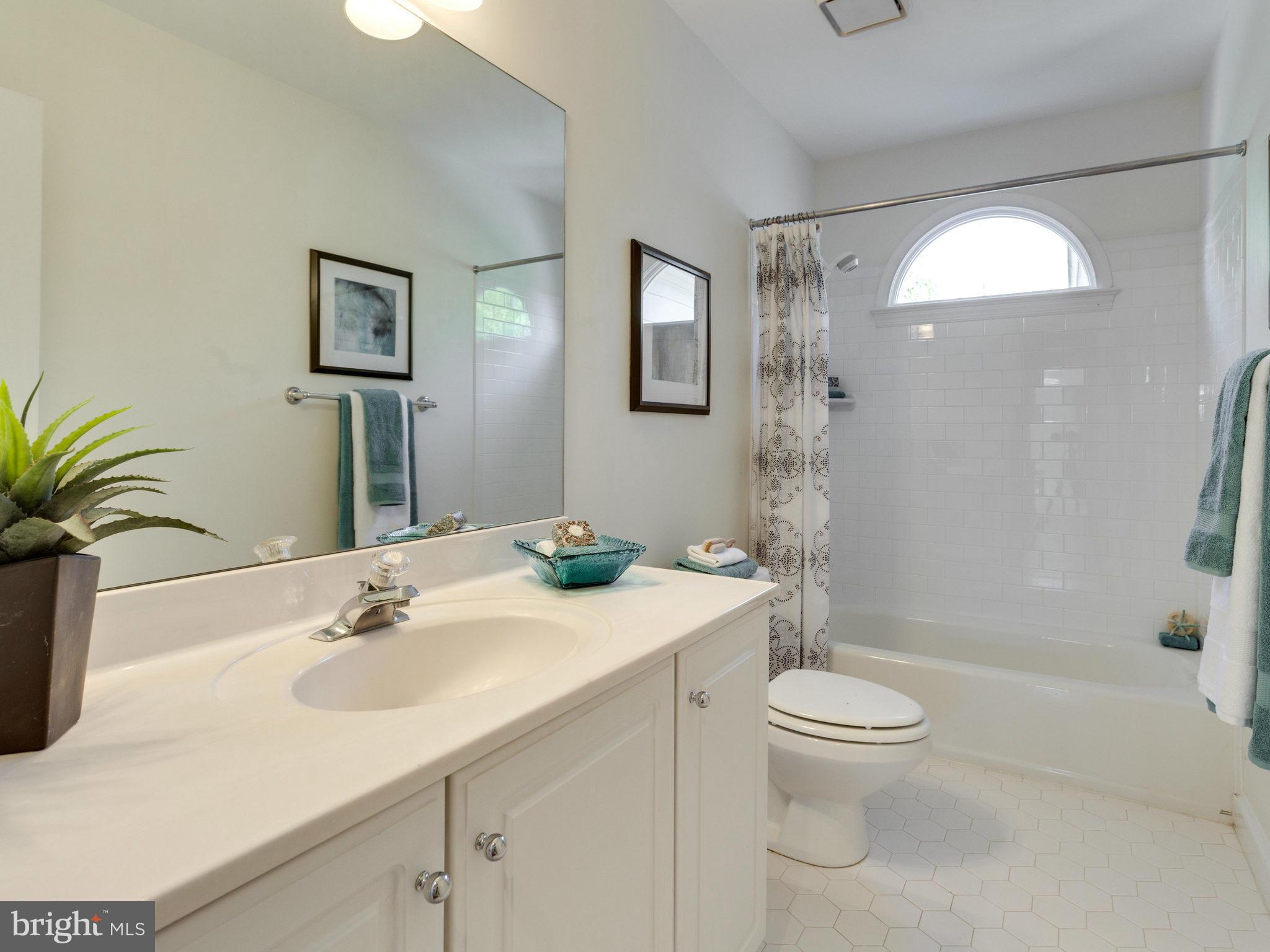 9423 Seven Locks Road Bethesda, MD 20817 - Photo 23 of 28 a bathroom with a sink a toilet and shower