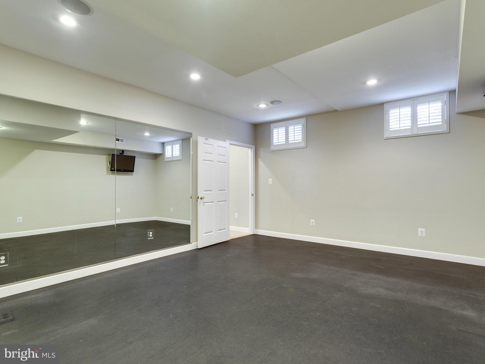 9423 Seven Locks Road Bethesda, MD 20817 - Photo 25 of 28 an empty room with windows and painted walls