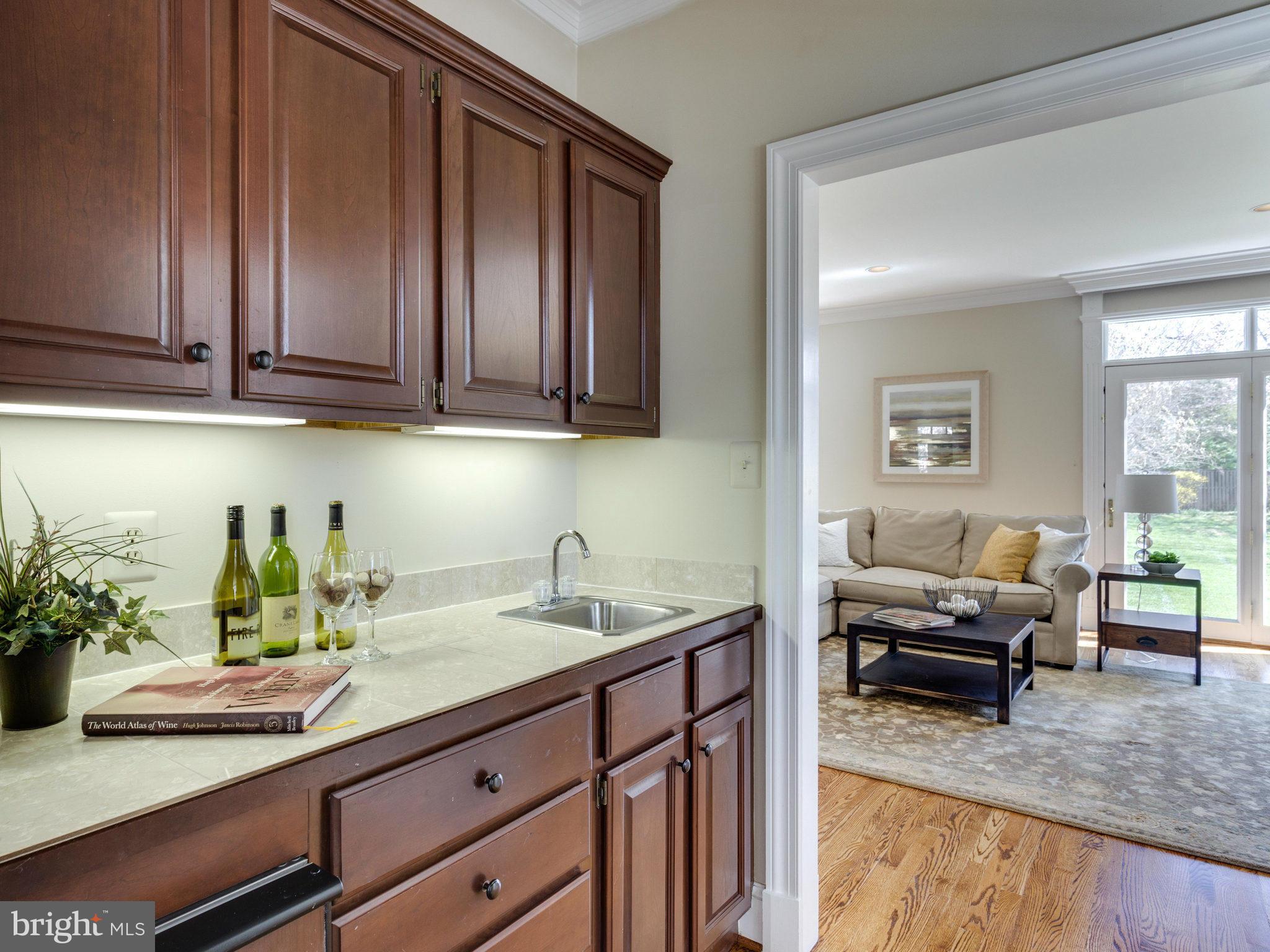 9423 Seven Locks Road Bethesda, MD 20817 - Photo 5 of 28 a kitchen with a sink and cabinets