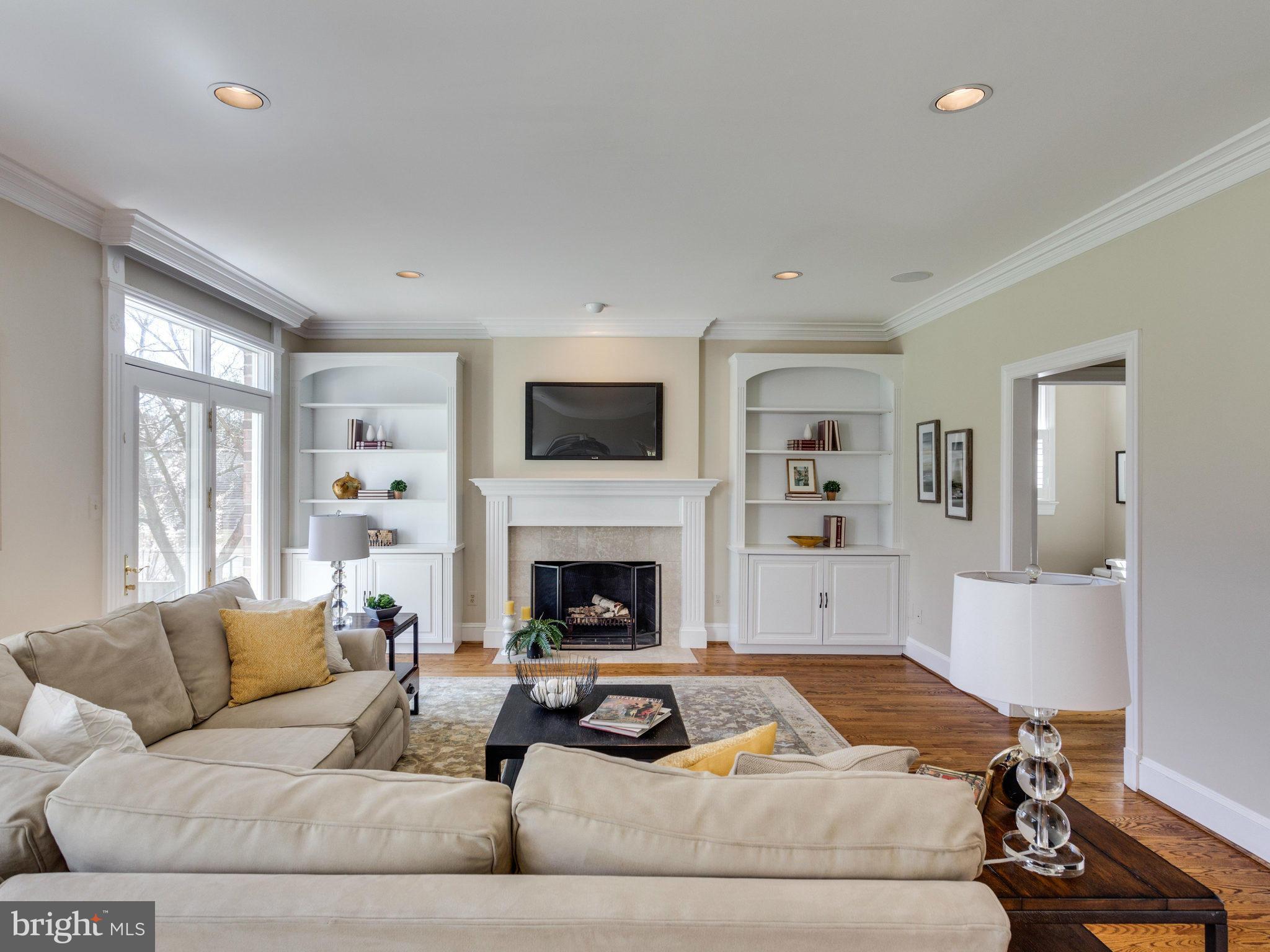 9423 Seven Locks Road Bethesda, MD 20817 - Photo 7 of 28 a living room with furniture and a fireplace