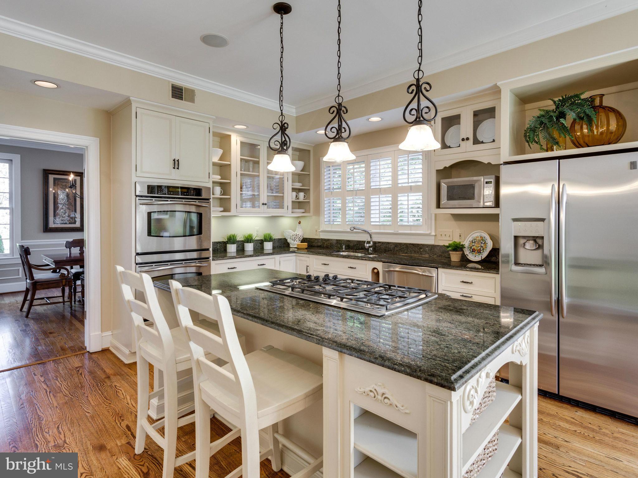 9423 Seven Locks Road Bethesda, MD 20817 - Photo 8 of 28 a kitchen with stainless steel appliances granite countertop a sink a stove and a refrigerator