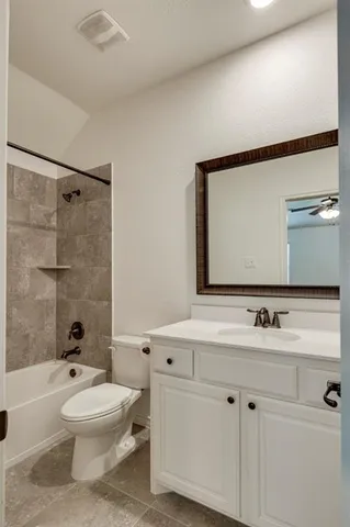 a bathroom with a toilet a sink a mirror a bathtub and shower