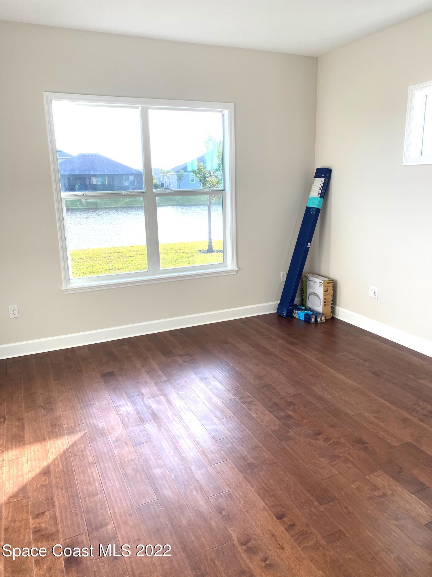8321 Paragrass Avenue Melbourne, FL 32940 - Photo 17 of 41 a view of a room with gym equipment