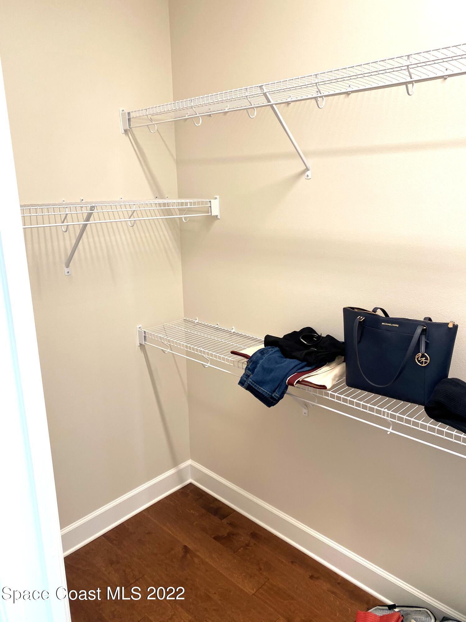 8321 Paragrass Avenue Melbourne, FL 32940 - Photo 22 of 41 a view of a room with racks on the wall